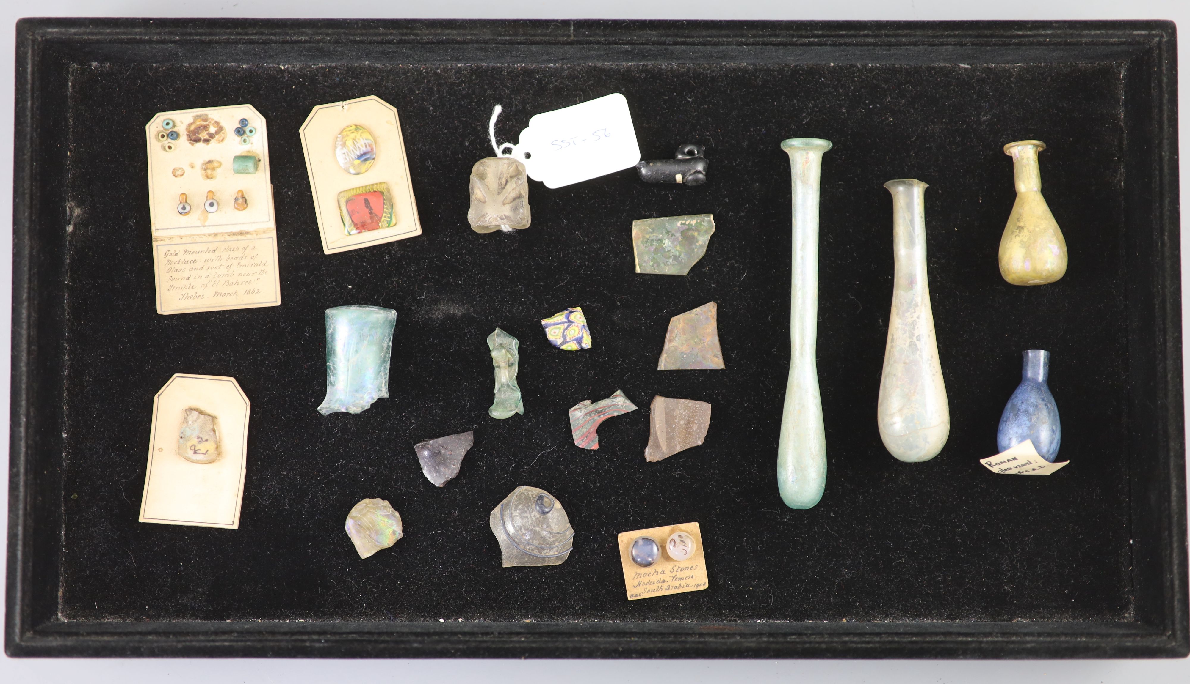 A group of three Roman glass vessels and Egyptian/Roman glass fragments, Provenance - A. T. Arber-Cooke